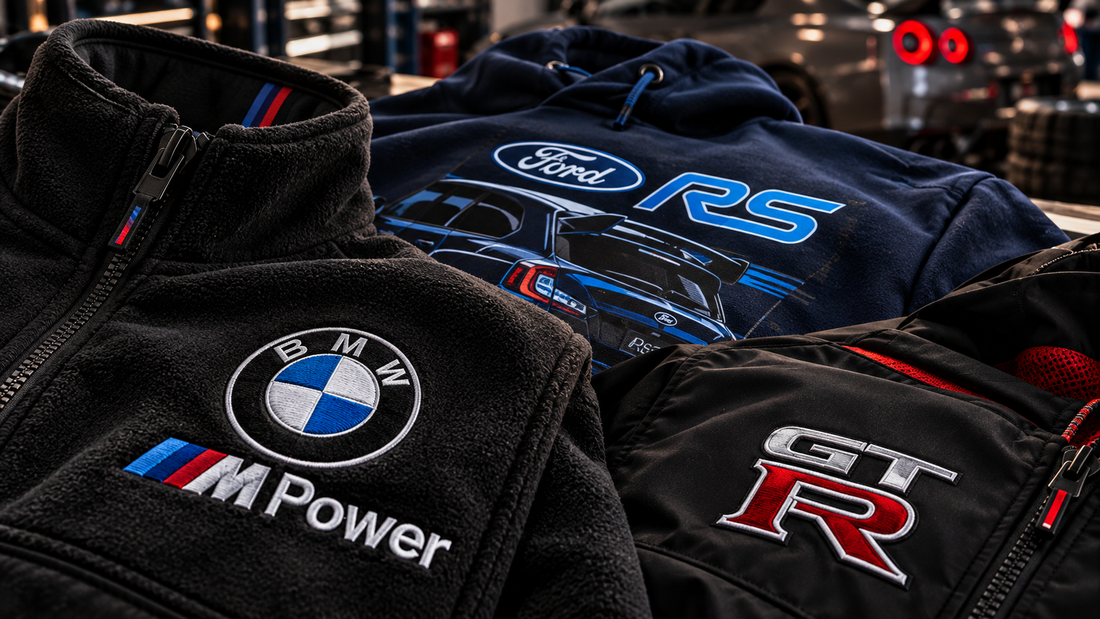 Embroidered motorsport apparel displayed in a performance workshop